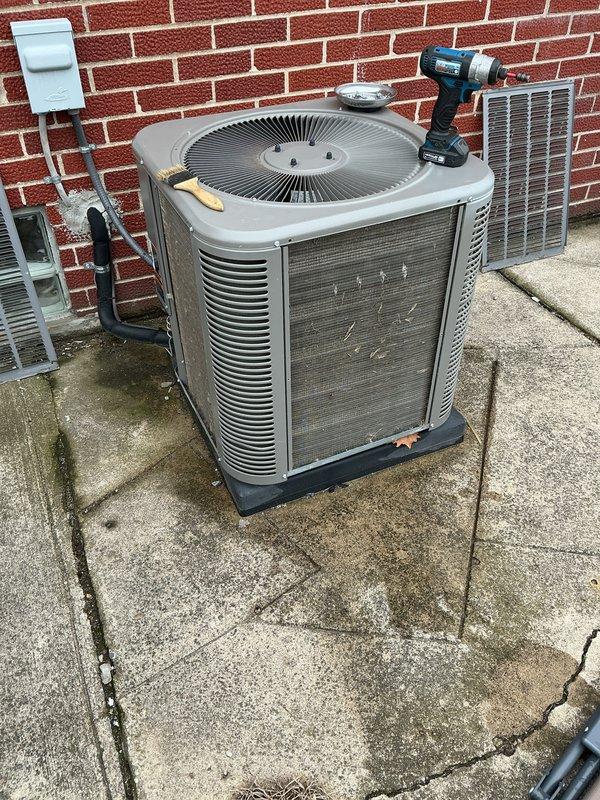 Completed comprehensive spring tune-up on 6-year-old central air conditioning system. Performed full system inspection of outdoor condensing unit, checked electrical connections at disconnect box, cleaned condenser coils, verified proper airflow through louvered panels, and tested operational performance. Unit operating within normal parameters with no deficiencies noted.