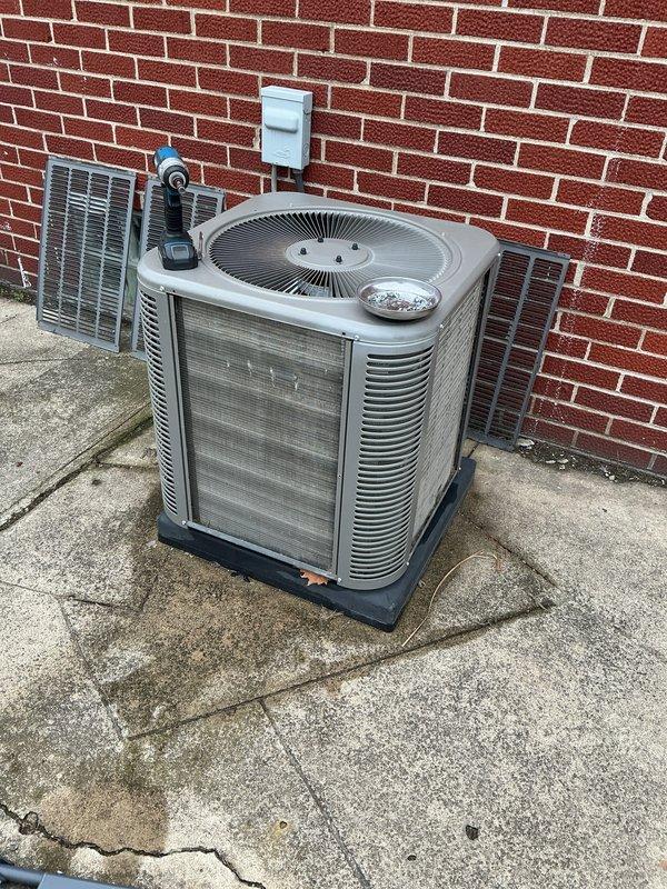 Completed comprehensive spring tune-up on 6-year-old central air conditioning system. Performed full system inspection of outdoor condensing unit, checked electrical connections at disconnect box, cleaned condenser coils, verified proper airflow through louvered panels, and tested operational performance. Unit operating within normal parameters with no deficiencies noted.