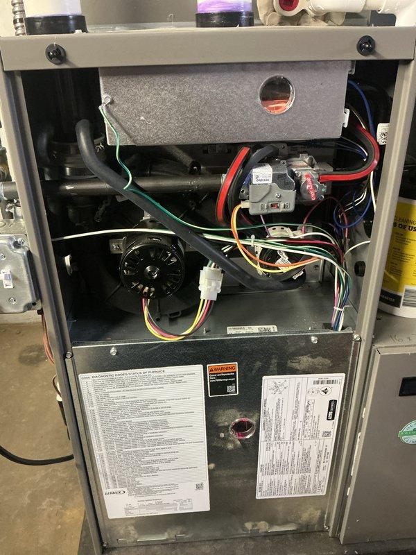 Completed scheduled Air Care Heating and Cooling recurring maintenance on residential furnace unit 4/102-5AHC. Performed comprehensive system inspection including visual examination of all internal components, electrical connections, gas valve assembly, blower motor operation, control boards, and heat exchanger. All wiring connections verified secure, burner assembly inspected, and system components documented with photographs for service records.