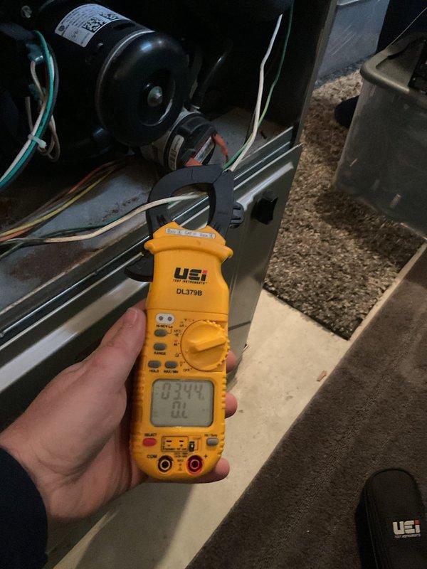 Completed annual furnace maintenance and tune-up on new unit as requested through membership program. Performed comprehensive system diagnostics using digital multimeter to verify proper electrical operation, measuring voltage at 240V and checking microamp readings at 0.031 BL. Inspected blower motor assembly, belt drive system, and all electrical connections. All components operating within normal parameters with no issues found.