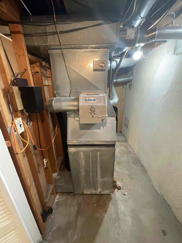 Provided estimate for replacement of 1994 furnace and air conditioning system located in basement utility area. Current equipment is operational but has reached end of expected service life at approximately 30 years old. Assessment included evaluation of existing ductwork configuration, electrical connections, and installation space requirements for new HVAC system under BOGO promotion terms.