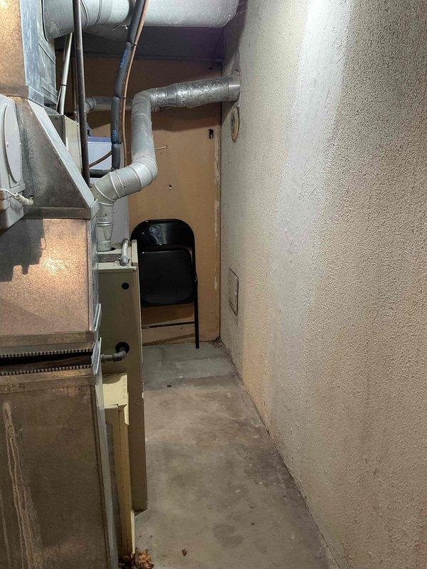 Provided estimate for replacement of 1994 furnace and air conditioning system located in basement utility area. Current equipment is operational but has reached end of expected service life at approximately 30 years old. Assessment included evaluation of existing ductwork configuration, electrical connections, and installation space requirements for new HVAC system under BOGO promotion terms.