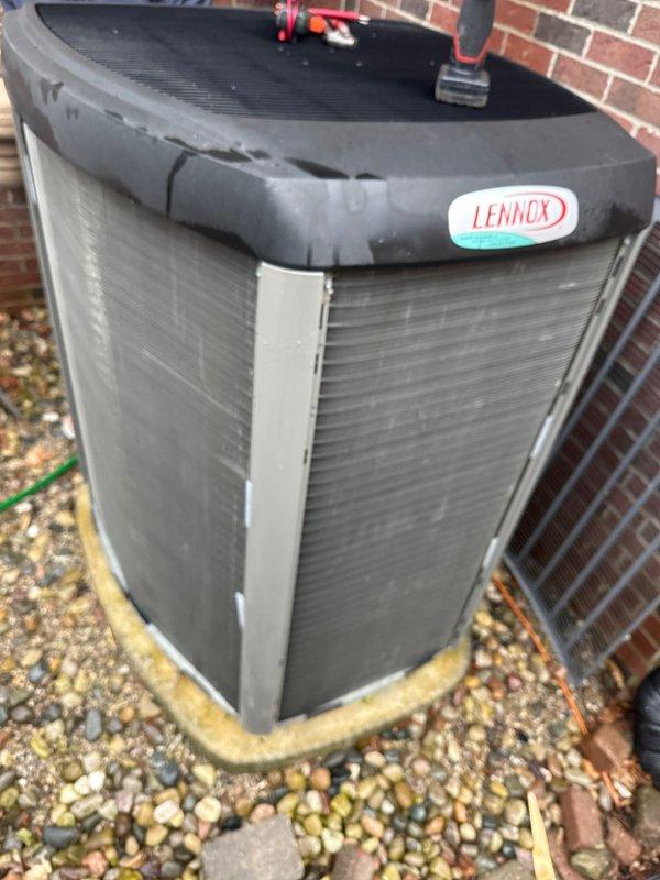 Completed annual cooling maintenance on Lennox air conditioning condenser unit. Performed comprehensive system inspection, cleaned condenser coils using customer-provided water hose to remove dirt and debris accumulation from exterior fins, checked refrigerant lines for proper insulation and connections, and verified unit operation. All components found to be functioning within normal parameters.