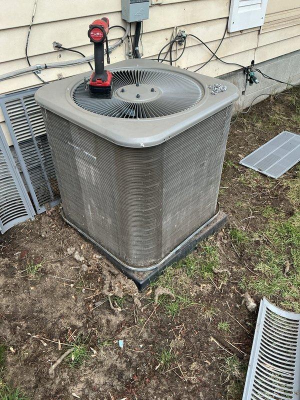 Completed annual cooling maintenance on residential split system air conditioning unit. Performed comprehensive inspection of outdoor condenser unit, checked electrical connections and conduit, tested fan motor operation, and verified proper system function. Unit showed signs of weathering and exterior deterioration but all mechanical components operating within normal parameters at time of service.
