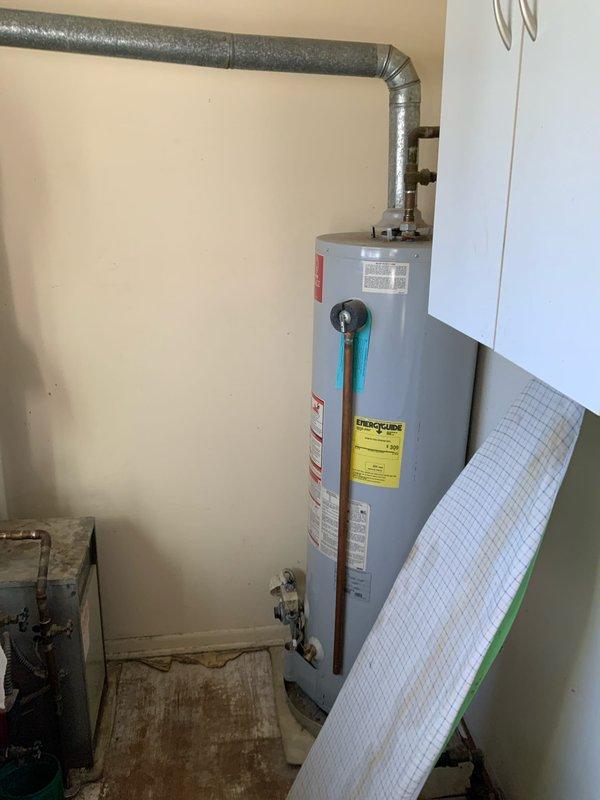 Provided estimate for complete HVAC system installation including furnace and air conditioning unit to replace existing 45+ year old baseboard heating system. Equipment to be located in laundry room at rear of residence. Assessed utility closet containing water heater, expansion tank, and existing ductwork infrastructure. Evaluated space constraints and mechanical room layout to determine optimal placement for new forced-air heating and cooling equipment, including required modifications to accommodate ductwork distribution system throughout home.