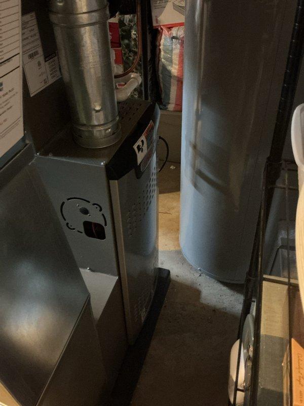 Completed routine HVAC maintenance inspection on residential furnace system and associated equipment in basement utility area. Replaced air scrubber bulb as requested and provided estimate for additional service needs. All equipment photographed and documented, system operating properly upon completion.