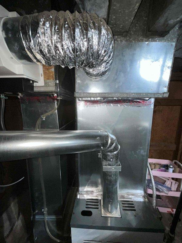 Conducted comprehensive full system HVAC estimate for residential property currently without air conditioning. Evaluated existing furnace/air handler installation in basement utility area and attic space, documenting current ductwork configuration including flexible aluminum ducting, rigid metal plenum connections, and condensate drainage system. Assessed structural considerations, existing infrastructure compatibility, and provided recommendations for complete heating and cooling system installation to meet customer's timeline of replacement within the next couple weeks.