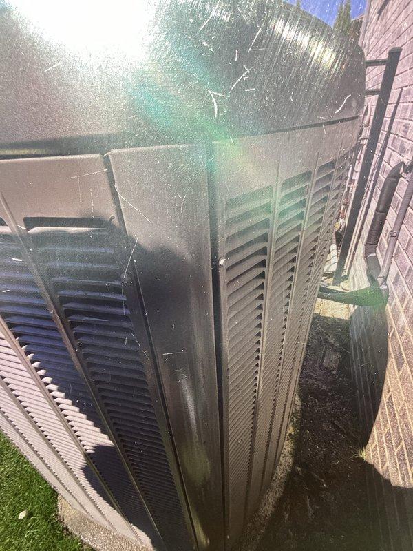 Completed annual HVAC maintenance on outdoor air handling unit. Cleaned heavily soiled condenser coil that had accumulated significant dust, debris, and fiber buildup affecting heat transfer efficiency. Installed new MERV 16 filter and replaced equipment pad to ensure proper unit leveling and stability.