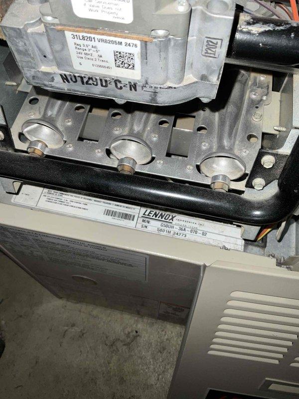 Conducted on-site evaluation for HVAC system replacement estimate. Assessed existing 25-year-old Lennox furnace with VR8205M gas valve and burner assembly, documenting current equipment condition and specifications. Inspected outdoor condensing unit with protective cover in place. Provided customer with equipment options and replacement recommendations for complete heating and cooling system upgrade. Customer expressed interest in promotional offering and indicated no immediate urgency for installation timeline.