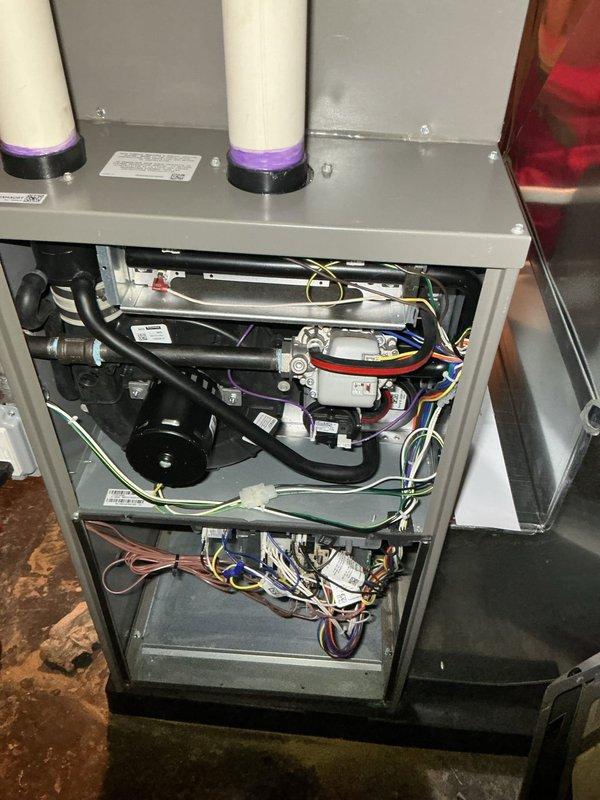 Completed comprehensive 5-year recurring ComfortGuard maintenance inspection on residential HVAC system. Performed thorough examination of all internal components including blower motor assembly, heat exchanger, electrical connections, refrigerant lines, and drainage tubing. Inspected and documented condition of dual filtration/purification devices mounted on upper platform, verified proper operation of control modules and relays, and assessed integrity of all wiring harnesses throughout the unit. All components found operating within normal parameters with no immediate service requirements identified.