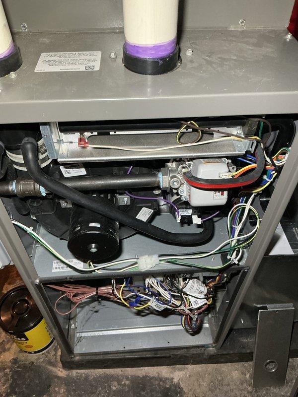 Completed comprehensive 5-year recurring ComfortGuard maintenance inspection on residential HVAC system. Performed thorough examination of all internal components including blower motor assembly, heat exchanger, electrical connections, refrigerant lines, and drainage tubing. Inspected and documented condition of dual filtration/purification devices mounted on upper platform, verified proper operation of control modules and relays, and assessed integrity of all wiring harnesses throughout the unit. All components found operating within normal parameters with no immediate service requirements identified.