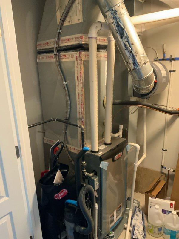 Conducted comprehensive assessment of existing 7-year-old HVAC system and tankless water heater located in basement mechanical room for equipment upgrade estimate. Evaluated current furnace, air conditioning unit, and tankless water heating system, all of which are operational. Documented existing installation configuration including PVC condensate drainage, refrigerant line sets, ductwork connections, and electrical panel capacity to determine specifications for replacement equipment package including furnace, air conditioning system, and tankless water heater upgrade.