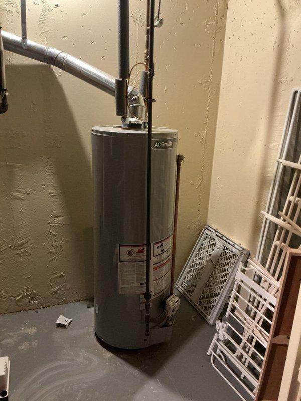 Completed annual HVAC maintenance inspection on residential forced-air heating system and associated mechanical equipment. Identified need for air filter replacement due to spots on existing filter, documented equipment condition including furnace unit, ductwork connections, and water heater installation with photographic records for service history.