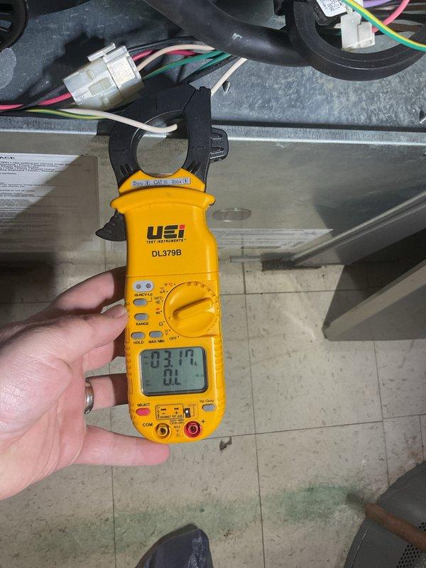 Performed scheduled air conditioning maintenance on residential cooling system. Conducted electrical measurements using digital clamp meter to verify proper amperage draw on compressor and system components, confirming unit operating within manufacturer specifications. All readings documented and system found to be functioning correctly with no deficiencies noted.