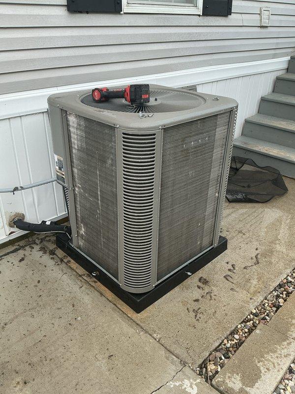 Completed annual cooling maintenance on residential AC condenser unit, including inspection of outdoor equipment and replacement of MERV 8 air filter at 15% capacity. Provided customer instruction on proper filter removal procedure for future maintenance.