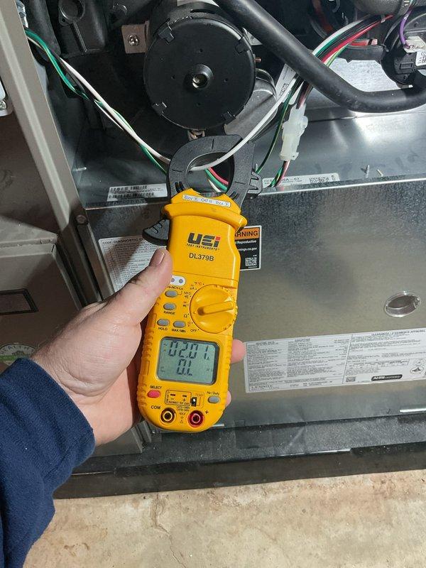 Completed comprehensive annual furnace heating maintenance tune-up on heating system. Performed diagnostic testing using digital multimeter to verify electrical readings and system performance, inspected blower motor assembly and internal components, checked all electrical connections and wiring for proper operation. System found to be operating within normal parameters with no issues identified.