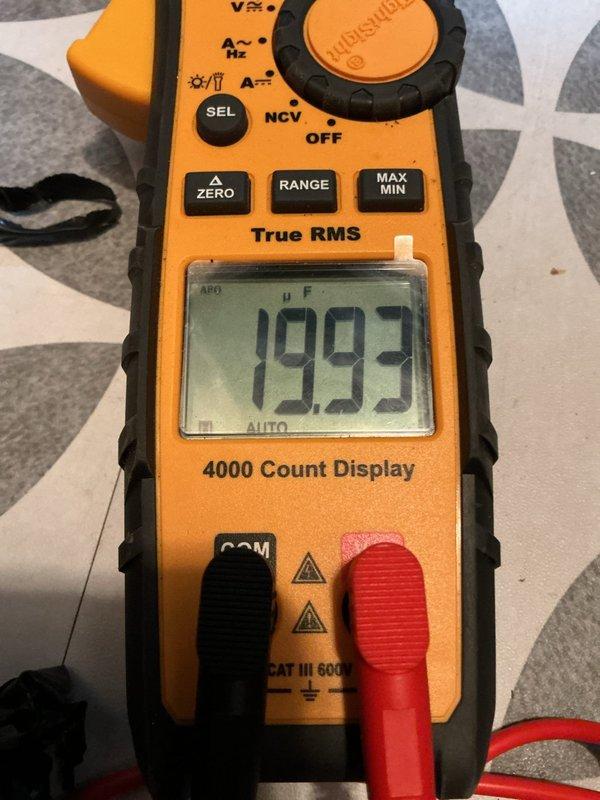 Completed annual cooling maintenance on residential split system air conditioning unit. Performed comprehensive system inspection including electrical testing of capacitor which measured 19.93 microfarads, verifying proper operation of compressor and condenser fan motor. Inspected outdoor condensing unit, refrigerant line set, and electrical disconnect box, confirming all components operating within normal parameters and system ready for cooling season.