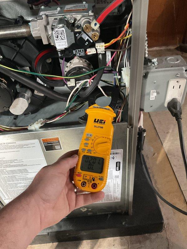 Completed comprehensive ComfortGuard Maintenance service on HVAC system, including installation of two furnace filters and humidifier pad replacement. Performed diagnostic testing using digital multimeter to verify proper electrical readings at gas valve assembly and measured amperage draw on blower motor to ensure system operating within manufacturer specifications. All components inspected and confirmed functioning correctly.