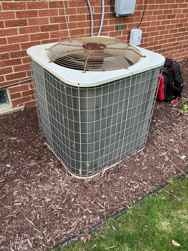 Completed annual air conditioning maintenance and tune-up on residential outdoor condenser unit per membership agreement. Performed comprehensive system inspection, checked electrical connections and conduit, verified fan operation and guard integrity, and assessed overall unit condition. All components found operating within normal parameters with routine seasonal maintenance successfully completed.