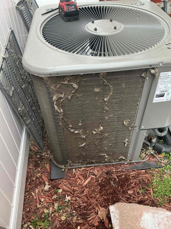 Completed routine ACM maintenance on residential air conditioning system. Connected diagnostic manifold gauges to measure system pressures and temperatures, verifying refrigerant charge and operational parameters. Observed heavy dirt and debris accumulation on condenser coils requiring attention. Documented equipment condition with photos showing significant contamination affecting heat transfer efficiency on outdoor unit.