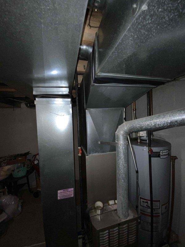 Performed full system estimate on 23-year-old Bryant HVAC system in 2,100 sq ft two-story home with basement. Upon arrival, found furnace inducer motor completely locked up with failed bearings, blower motor actively leaking, run capacitor testing weak, and ignitor measuring above acceptable resistance specifications. Due to age of equipment (2003) and extent of multiple component failures, recommended complete system replacement rather than repair.