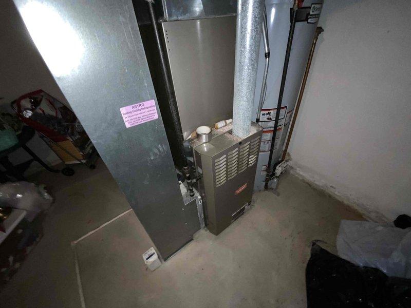 Performed full system estimate on 23-year-old Bryant HVAC system in 2,100 sq ft two-story home with basement. Upon arrival, found furnace inducer motor completely locked up with failed bearings, blower motor actively leaking, run capacitor testing weak, and ignitor measuring above acceptable resistance specifications. Due to age of equipment (2003) and extent of multiple component failures, recommended complete system replacement rather than repair.