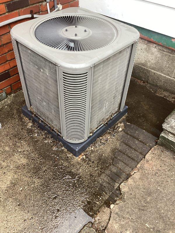 Completed annual cooling maintenance on outdoor condensing unit. Performed comprehensive system inspection, checked refrigerant levels and pressures, cleaned condenser coils, verified proper airflow through louvered panels, and confirmed operational status of all components. Unit operating within normal parameters despite exterior weathering and cosmetic deterioration of housing.