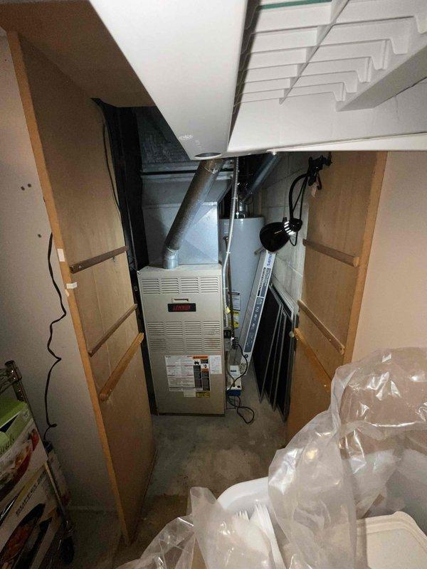 Provided comprehensive estimate for furnace replacement system in basement installation. Existing 30-year-old furnace unit assessed and documented with photos showing current equipment configuration, ductwork connections, and electrical components. Customer scheduled for morning appointment window to discuss replacement options and system specifications.