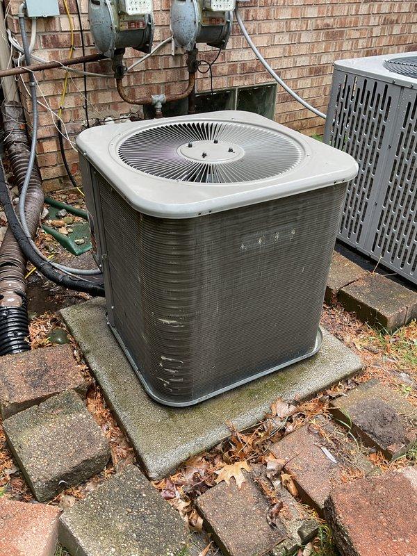 # HVAC Maintenance - ACM Completed

Performed comprehensive annual preventive maintenance on residential air conditioning system. Conducted thorough inspection of outdoor condenser unit, noting significant weathering and exterior discoloration consistent with age and environmental exposure. Assessed unit operation and verified proper function of all major components including compressor, condenser fan motor, and electrical connections.

Inspected refrigerant line sets running from condenser to building, checking for proper insulation and secure mounting. Examined electrical disconnect, conduit routing, and wall-mounted meter connections for code compliance and safe operation. Evaluated concrete pad stability and unit leveling to ensure proper drainage and equipment support.

Noted accumulation of organic debris including leaves and moss growth on equipment pad and surrounding pavers. Documented presence of multiple HVAC units serving the property. All systems operational with no immedi