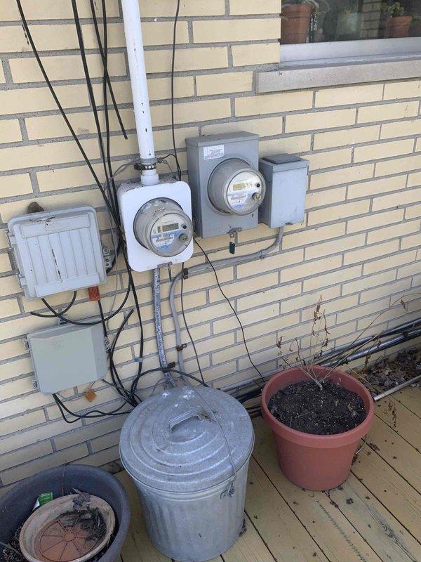 Provided estimate for complete furnace and air conditioning system replacement in basement location. Current air conditioning unit is non-operational while existing furnace remains functional. Assessed existing HVAC installation including ductwork configuration, electrical service requirements at exterior meter location, and refrigerant line routing. Documented basement equipment layout with overhead ductwork and concrete block construction for proper sizing and installation planning of replacement system.