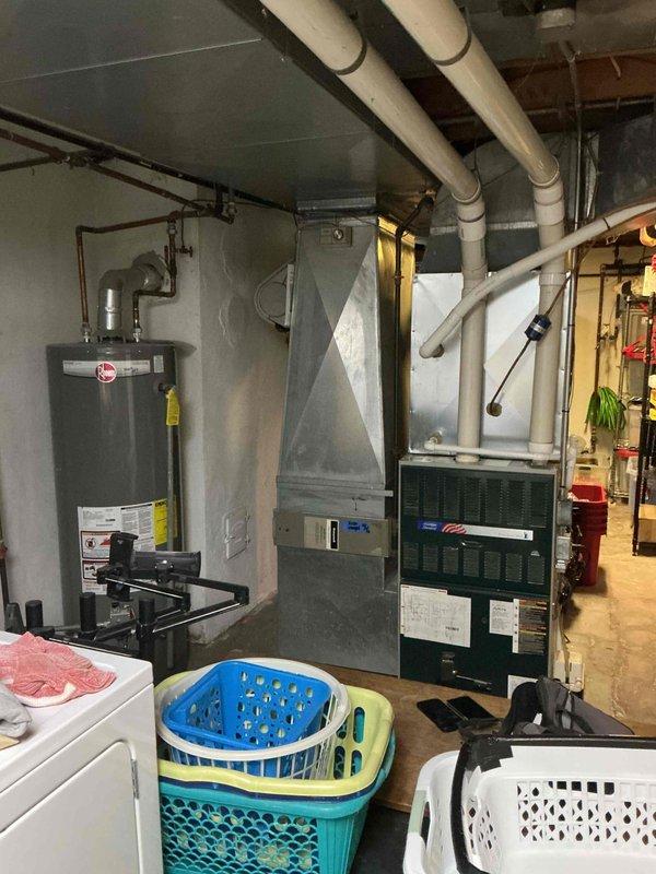 Conducted comprehensive assessment of 32-year-old natural gas furnace system located in basement that was non-operational at time of visit. Evaluated existing HVAC equipment configuration including furnace unit, ductwork distribution system, and PVC venting infrastructure to determine replacement requirements and specifications. Documented current system layout, mechanical room conditions, and spatial constraints to provide accurate equipment replacement estimate for complete furnace system upgrade.