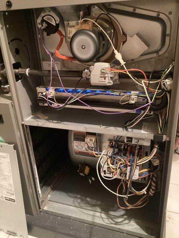 Completed comprehensive tune-up maintenance on two furnace units and one air conditioning system, all approximately 8-9 years old and located in basement. Performed full system inspections including checking draft inducer motors, flame sensors, gas valve assemblies, heat exchangers, burner assemblies, and main control boards on both furnaces. Replaced air filters on both furnace units, installed new humidifier pads, and replaced UVC bulbs in both systems to maintain optimal indoor air quality and system efficiency. Verified thermostat operation and calibration, tested all electrical connections and wiring harnesses, and inspected heat exchanger fins for proper condition. All systems tested and confirmed operating within manufacturer specifications upon completion.