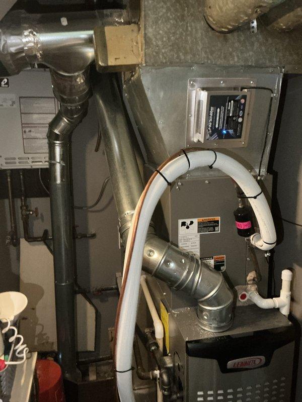 Replaced existing flue system with new 4-inch B-Vent piping and installed 4-inch chimney liner in bungalow residence. Installation included five 4-inch B-Vent 90-degree elbows, one 26-inch pipe section, one 16-inch section, and one 12-inch section, with all joints properly mortared and sealed. Work completed in preparation for scheduled inspection, ensuring proper venting for HVAC equipment and compliance with code requirements.