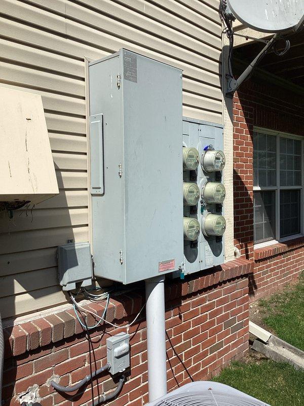 Performed comprehensive whole home electrical safety inspection on residential property built in 2004/2005. Conducted thorough evaluation of interior electrical systems including receptacle testing and verification of proper grounding and polarity throughout living spaces. Inspected exterior electrical infrastructure including main service panel, meter bank configuration with multiple utility meters, and associated conduit runs. Verified proper mounting and weatherproofing of exterior electrical components on vinyl siding and brick foundation. All electrical systems found to be functioning properly with no deficiencies or safety concerns identified. No repairs required at this time.