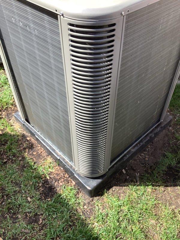 Completed annual preventative maintenance and tune-up on residential air conditioning condenser unit. Connected manifold gauges to measure system pressures, inspected exterior housing and louvers for damage, verified fan operation, and documented unit condition with photographs. All components found operating within normal parameters.