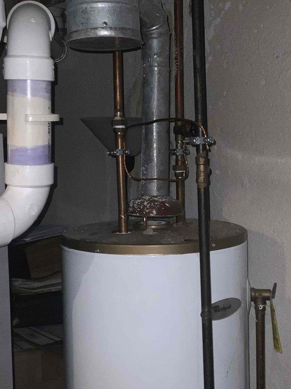 Completed on-site assessment for air conditioner replacement estimate. Existing 15-year-old AC system evaluated for replacement due to age and operational concerns. Documented current mechanical room configuration including existing furnace, air handler, water heater, and associated ductwork and plumbing connections to determine optimal placement and specifications for new air conditioning equipment installation.