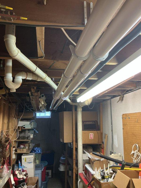 Completed full HVAC system installation including a 70,000 BTU furnace and 2.5 ton rear-discharge air conditioning unit in basement utility area. Installation included humidifier integration and reconnection of existing ductwork to new equipment. All required mechanical and electrical permits were obtained prior to installation, and system was tested for proper operation upon completion.