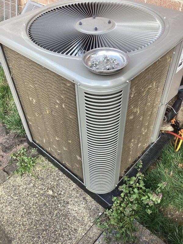 Completed scheduled air conditioning maintenance on outdoor condenser unit. Performed comprehensive system diagnostics using digital multimeter to verify electrical performance and operational parameters. Inspected condenser coils, fan assembly, and cabinet condition, noting normal weathering consistent with outdoor installation. Unit operating within manufacturer specifications at time of service.