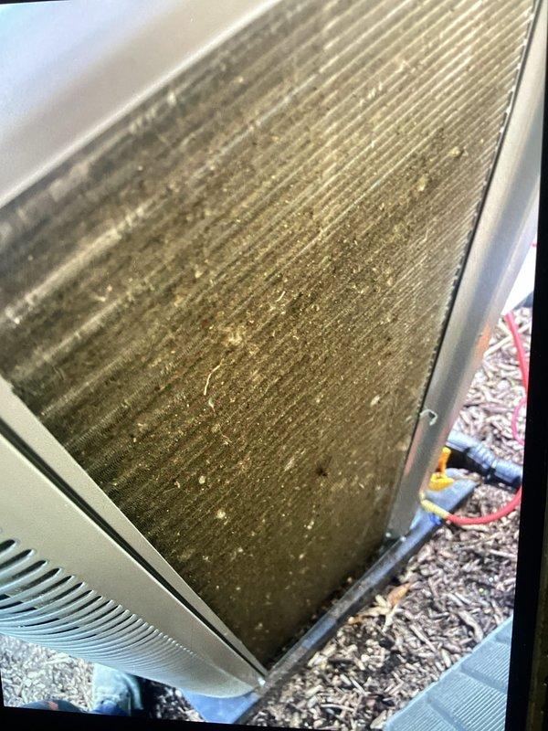 Completed routine Air Care Cooling maintenance inspection on HVAC system. Documented current condition of evaporator coil and condenser fins, which showed significant accumulation of dust, dirt, and debris throughout the fin assembly, though unit maintained structural integrity and operational status.