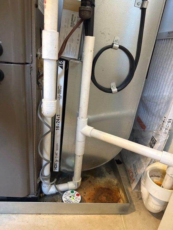 Completed full installation of 2.5-ton air conditioning system with matching evaporator coil in residential utility closet. System integrated with existing Coleman furnace, including refrigerant line set with insulation, condensate drainage connections to existing pump assembly, electrical reconnection, and ductwork modifications with metal transition elbows. All mechanical, electrical, and AC permits obtained prior to installation, with left-side condenser placement and complete system startup performed.