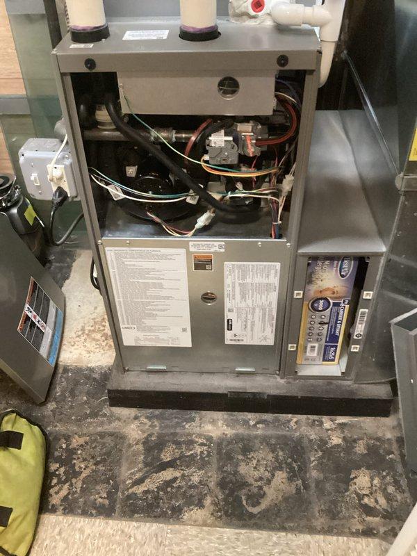 Completed annual heating maintenance on Lennox furnace system. Performed comprehensive inspection of unit components, including burner assembly, heat exchanger, blower motor, and control boards. Verified proper operation of intake and exhaust venting system with PVC piping. Checked all electrical connections, wiring harnesses, and safety controls for secure operation. Inspected refrigerant lines and copper tubing connections. Documented equipment condition through photographic records. Unit operating within normal parameters at time of service completion.