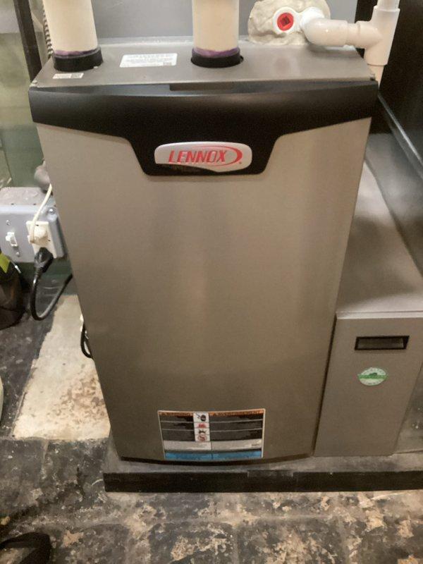 Completed annual heating maintenance on Lennox furnace system. Performed comprehensive inspection of unit components, including burner assembly, heat exchanger, blower motor, and control boards. Verified proper operation of intake and exhaust venting system with PVC piping. Checked all electrical connections, wiring harnesses, and safety controls for secure operation. Inspected refrigerant lines and copper tubing connections. Documented equipment condition through photographic records. Unit operating within normal parameters at time of service completion.