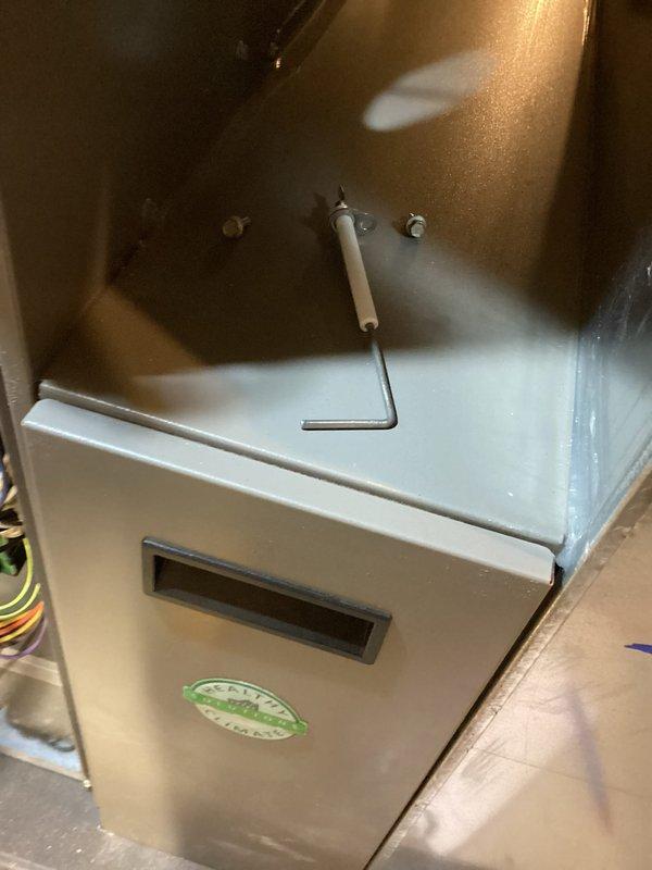 Completed comprehensive HVAC maintenance on a 5-year-old forced air heating system and air conditioning unit, both operating within normal parameters. Performed standard tune-up procedures including inspection of indoor furnace components, heat exchanger, and safety controls, as well as outdoor condenser unit evaluation with focus on fan operation, refrigerant levels, and airflow through louvered panels. Documentation captured via photos showing interior furnace cabinet with sensor mechanisms and exterior condenser unit positioned on turf with proper clearances maintained.