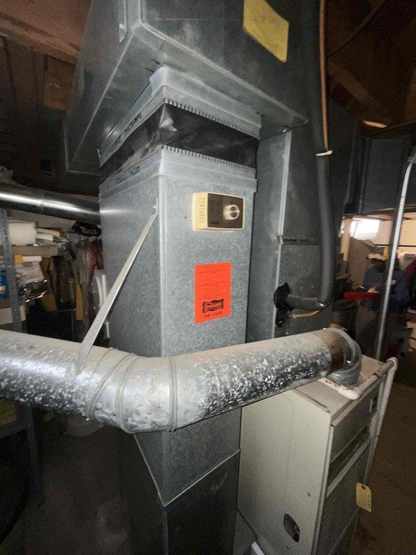 Conducted on-site evaluation of existing HVAC system in residential basement for equipment replacement estimate. Assessed 30-year-old air conditioning unit and furnace, both at end of serviceable life expectancy. Documented current equipment configuration including vertical air handler, ductwork connections, and overall system layout through photographic documentation. Provided replacement recommendations for aging equipment prior to peak cooling season.