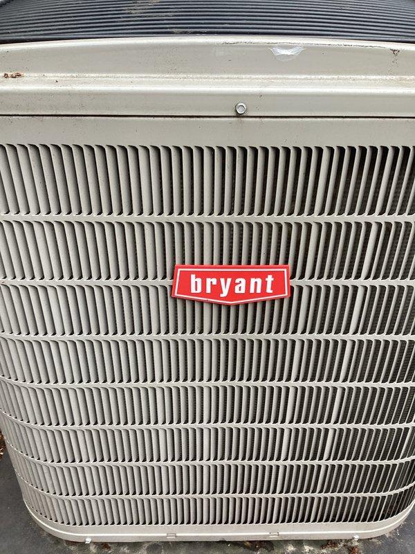 Completed annual preventative maintenance on Bryant outdoor condensing unit. Performed comprehensive inspection of condenser coil fins, verified proper airflow through vertical louvers, and assessed overall unit condition. Exterior housing showed normal weathering with minor surface rust and paint degradation on upper panels. Condenser coil fins displayed typical outdoor exposure with light debris accumulation between fin spaces. Unit operational and functioning within normal parameters at time of service completion.
