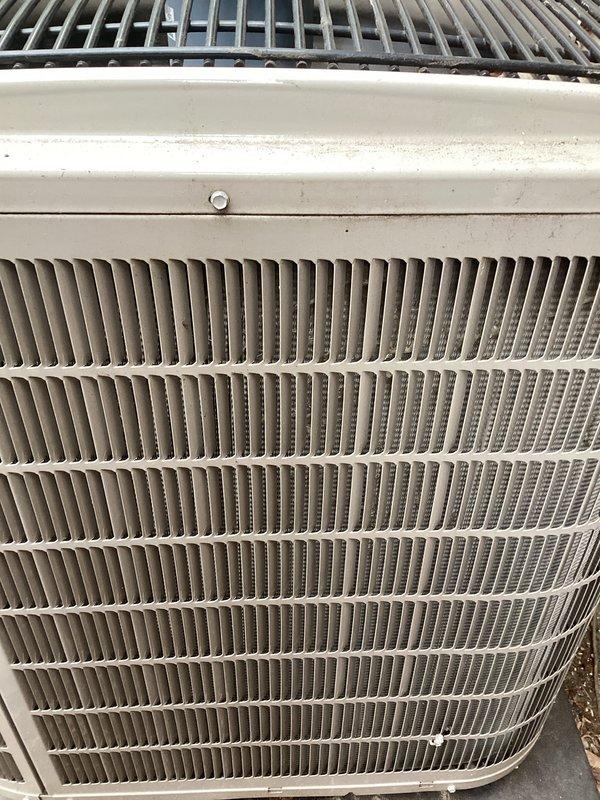 Completed annual preventative maintenance on Bryant outdoor condensing unit. Performed comprehensive inspection of condenser coil fins, verified proper airflow through vertical louvers, and assessed overall unit condition. Exterior housing showed normal weathering with minor surface rust and paint degradation on upper panels. Condenser coil fins displayed typical outdoor exposure with light debris accumulation between fin spaces. Unit operational and functioning within normal parameters at time of service completion.