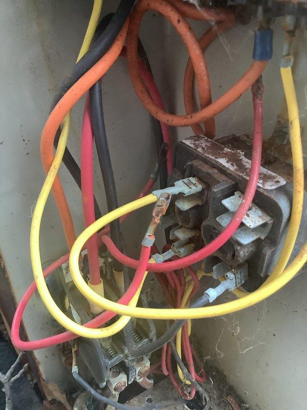 Responded to complaint of air conditioning unit not shutting off on 15-year-old system located on east side of property. Upon inspection, discovered severely corroded contactor and terminal connections with heavy rust and oxidation throughout the electrical assembly. The contactor showed extensive deterioration from prolonged moisture exposure, with corroded terminals, mounting hardware, and connection points. Despite the advanced corrosion, all wire connections remained intact and the system continued to provide adequate cooling. Identified the failed contactor as the root cause preventing the unit from cycling off properly. Checked out without work performed at customer's request to evaluate repair options given the age and condition of the unit.