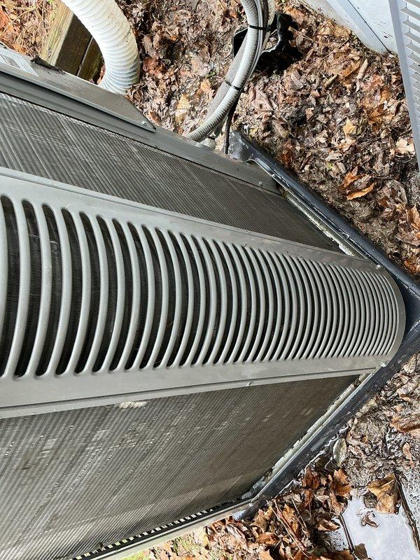 Completed annual cooling maintenance on residential outdoor condenser unit. Inspected system components, cleaned top grille ventilation slats that had accumulated dirt and debris, replaced air filters and evaporative cooling pads as needed, verified proper airflow through heat exchange system, checked electrical connections and disconnect box, and confirmed refrigerant lines and conduit were secure and in good condition.