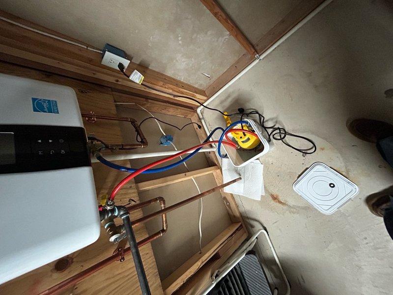 Performed annual maintenance on tankless water heater system, including complete descaling flush to remove mineral buildup and ensure optimal heat exchanger performance. Connected circulation pump with supply and return hoses, ran manufacturer-recommended descaling solution through the unit for proper cleaning cycle, and verified all connections for proper operation. System tested and confirmed functioning efficiently with no leaks detected upon completion.