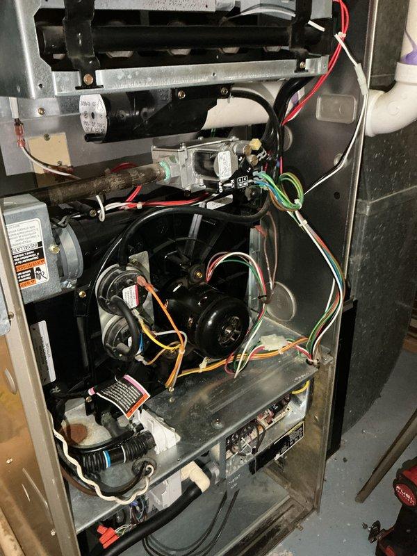 Responded to no heat call for furnace intermittently cycling on and off. Upon inspection, found system operational but short-cycling during heating mode. Removed access panels and inspected internal components including heat exchanger, blower assembly, gas valve, and ignition controls. Verified gas supply and electrical connections throughout unit. Previous service history indicated blocked condensate drain issue. Checked drainage system and confirmed proper flow with no current blockages. Monitored multiple heating cycles to observe intermittent operation pattern. System age could not be verified from available documentation. Photographed equipment and internal components for service records. Unit cycling properly at time of departure with warm air delivery confirmed.